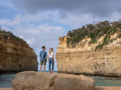 Travellers standing in a Great Ocean Road gorge